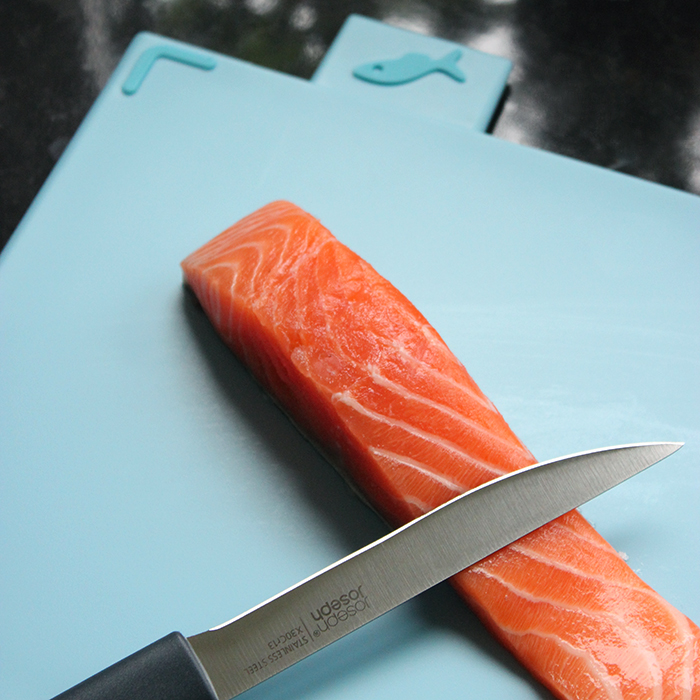 Joseph Joseph light blue chopping board for raw fish.