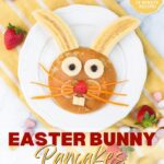 Easter bunny pancake decorated with bananas, strawberry, blueberries and carrot. Image with text for Pinterest.