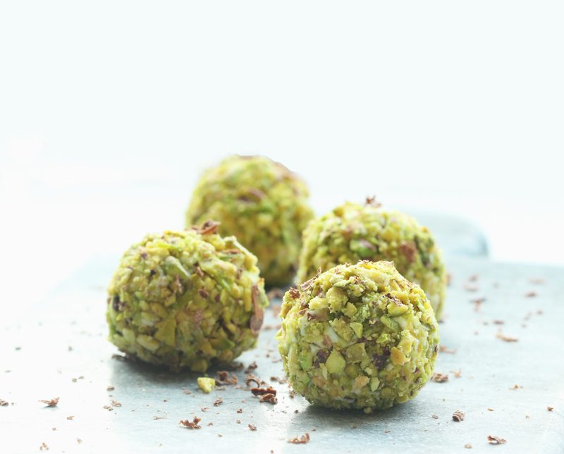 cannoli truffles topped with a pistachio crust 