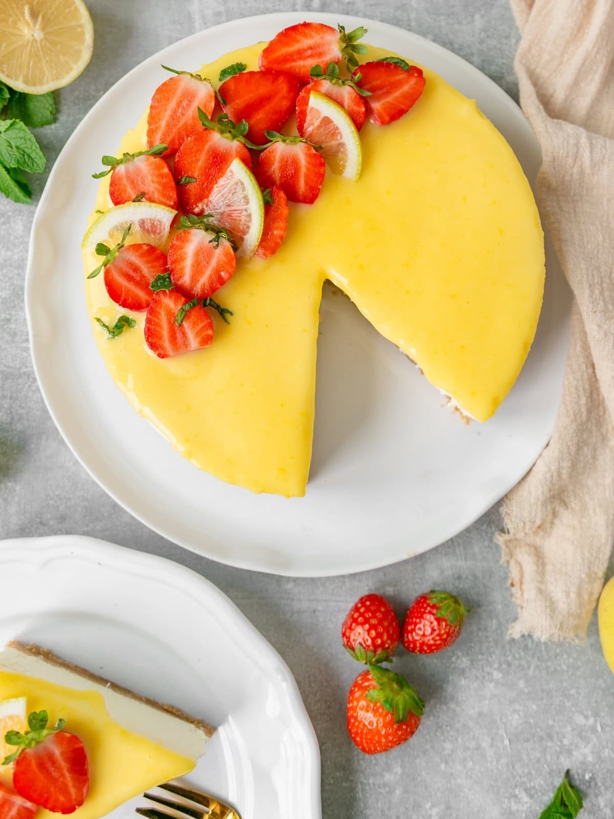 Easy yuzu cheesecake topped with yuzu curd and strawberries