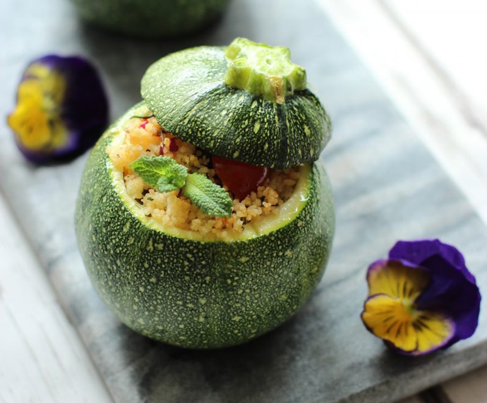 one couscous salad stuffed round zucchini.