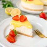 Yuzu cheesecake topped with yuzu curd and strawberries.