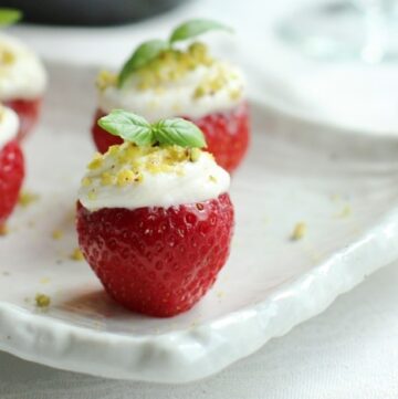 Looking for an easy delicious party dessert? These cheesecake filled strawberries are the perfect sweet bite for any occasion! Healthy and light recipe by The Petite Cook