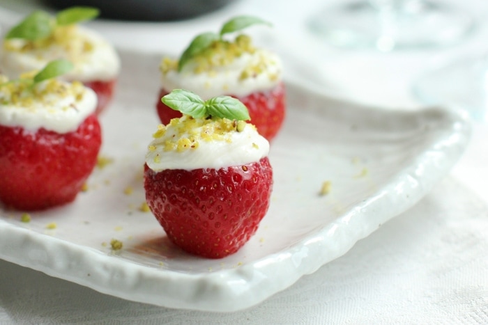 Looking for an easy delicious party dessert? These cheesecake filled strawberries are the perfect sweet bite for any occasion! Healthy and light recipe by The Petite Cook