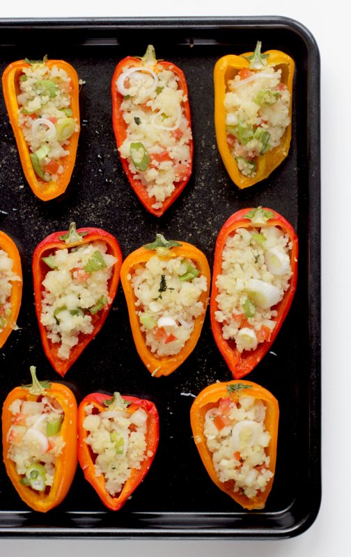 cous cous stuffed mini peppers on a baking tray