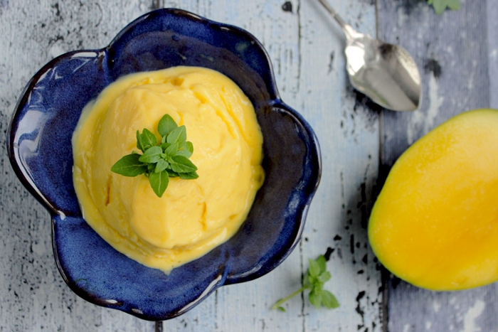 Easy Egg-free Mango Ice Cream is the best treat you can make to yourself on a hot summer day. Plus vegan option is also available.