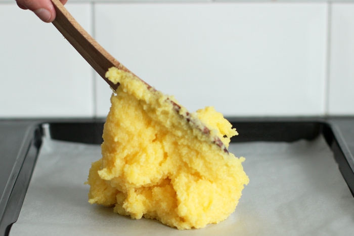 recipe step 2: spread the cooked polenta over a baking tray covered with parchment paper