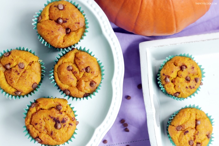 dairy-free pumpkin muffins on a cake stand and on a serving tray