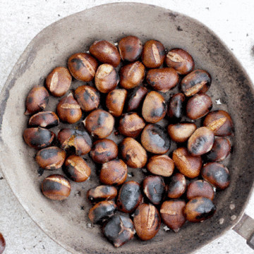 Roasted chestnuts in a large pan