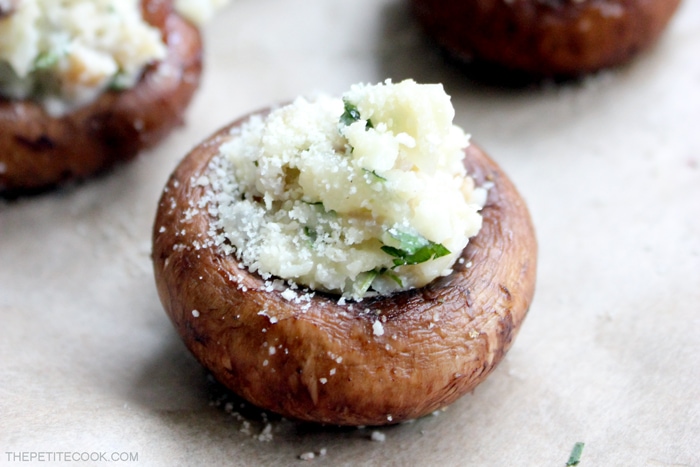 Easy Stuffed Mushrooms are such a classic and versatile appetizer for all occasions - especially holidays. But easy enough to prepare as a side dish for any day of the week. Plus they're gluten-free and dairy-free! Recipe from www.thepetitecook.com