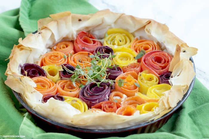 This light and vibrant maple-glazed carrot phyllo tart is packed with seasonal rainbow carrots and fresh aromatic ricotta cheese - Ready in just 20 mins and 8 ingredients, it makes a showstopping vegetarian appetizer or main to share. Perfect for holiday parties! Recipe from www.thepetitecook.com