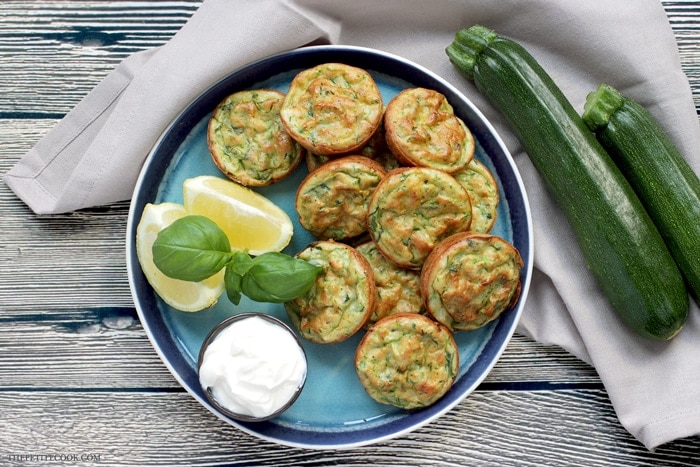 Baked Zucchini Fritters - Healthy, vegetarian, gluten-free and dairy-free - They're so tasty and versatile, you can serve them for breakfast, lunch AND dinner! Recipe from www.thepetitecook.com