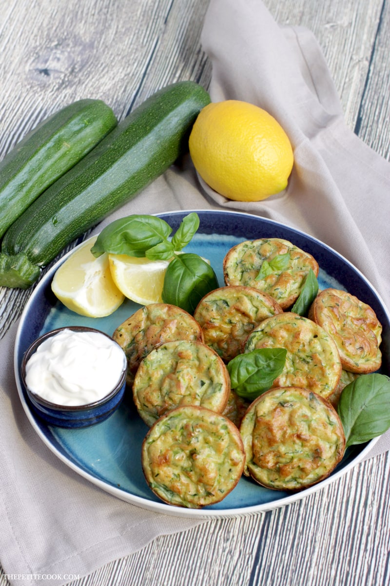 Baked Zucchini Fritters - Healthy, vegetarian, gluten-free and dairy-free - They're so tasty and versatile, you can serve them for breakfast, lunch AND dinner! Recipe from www.thepetitecook.com