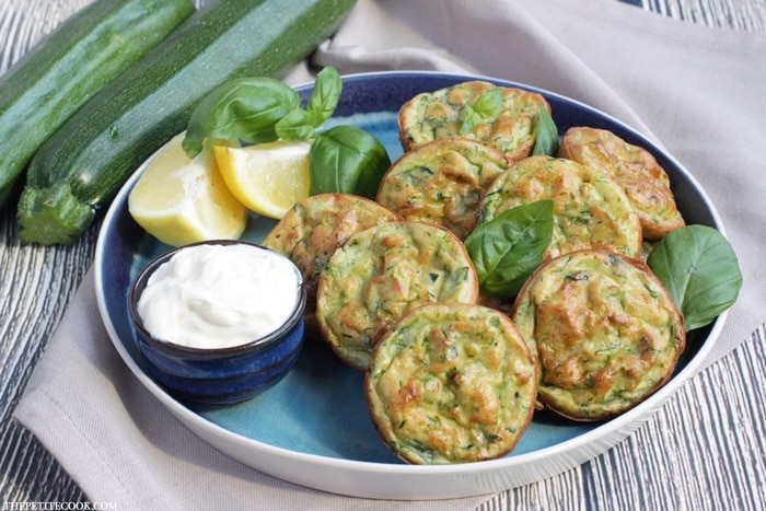 Baked Zucchini Fritters - Healthy, vegetarian, gluten-free and dairy-free - They're so tasty and versatile, you can serve them for breakfast, lunch AND dinner! Recipe from www.thepetitecook.com