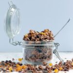 Delicious, easy, healthy, wholesome, Homemade Chocolate Granola. Vegan, gluten-free and better than store-bought, this crunchy mix of oats, healthy nuts & seeds and chocolate is the best way to start your day. Recipe from www.thepetitecook.com