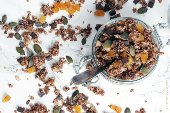 Delicious, easy, healthy, wholesome, Homemade Chocolate Granola. Vegan, gluten-free and better than store-bought, this crunchy mix of oats, healthy nuts & seeds and chocolate is the best way to start your day. Recipe from www.thepetitecook.com