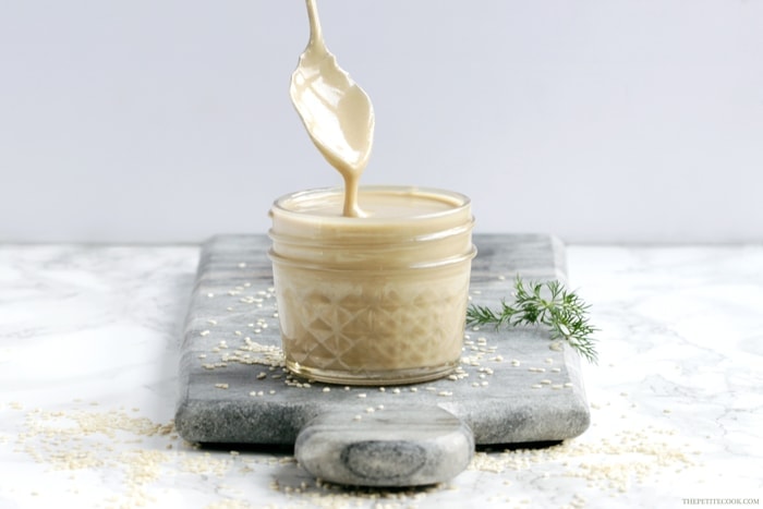How To Make Tahini Sauce - Making your own homemade tahini sauce is easier than you think - You need only 2 ingredients to make a delicious sauce that will instantly upgrade all your healthy recipes. Vegan, Glutenfree and Dairyfree recipe by www.thepetitecook.com