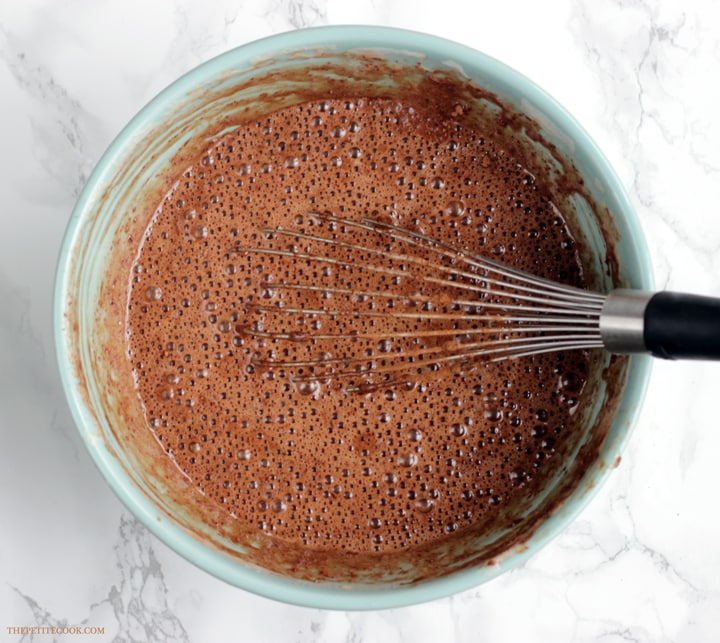 2-Ingredient nutella cake mixture in a bow with whisk in.