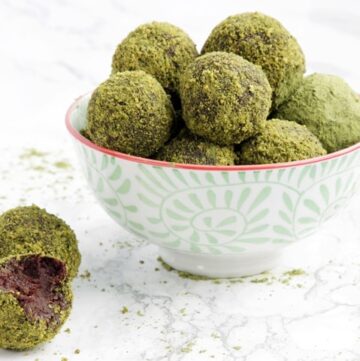 4-ingredient orange cocoa truffles rolled in matcha powder and pistachios. A deliciously energy-packed healthy treat ready in just 10 minutes! - Vegan - Gluten-free - Dairy-free recipe from www.thepetitecook.com
