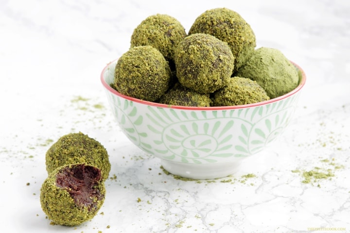 4-ingredient orange cocoa truffles rolled in matcha powder and pistachios. A deliciously energy-packed healthy treat ready in just 10 minutes! - Vegan - Gluten-free - Dairy-free recipe from www.thepetitecook.com