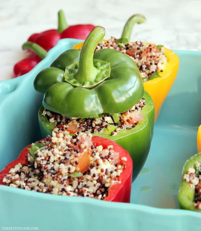 red pepper, yellow pepper and green bell pepper stuffed with quinoa mixture