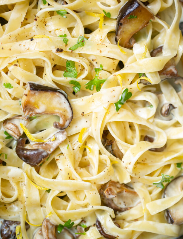 shiitake mushrooms cooking with pasta in a pan