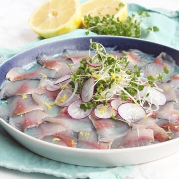 This salt & vinegar mackerel carpaccio requires very little effort and delivers a fantastic starter for an elegant dinner. Perfect to celebrate St David's day and any other special occasion! recipe from www.thepetitecook.com