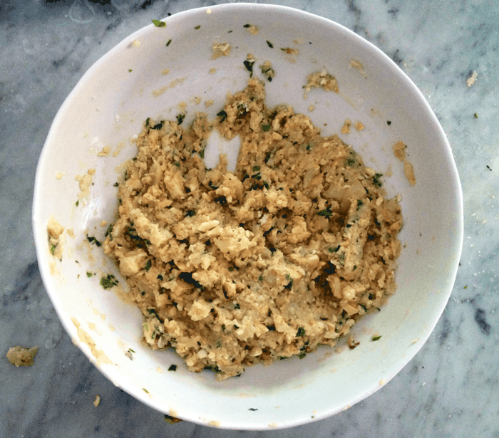 cauliflower fritters mixture in a large white bowl