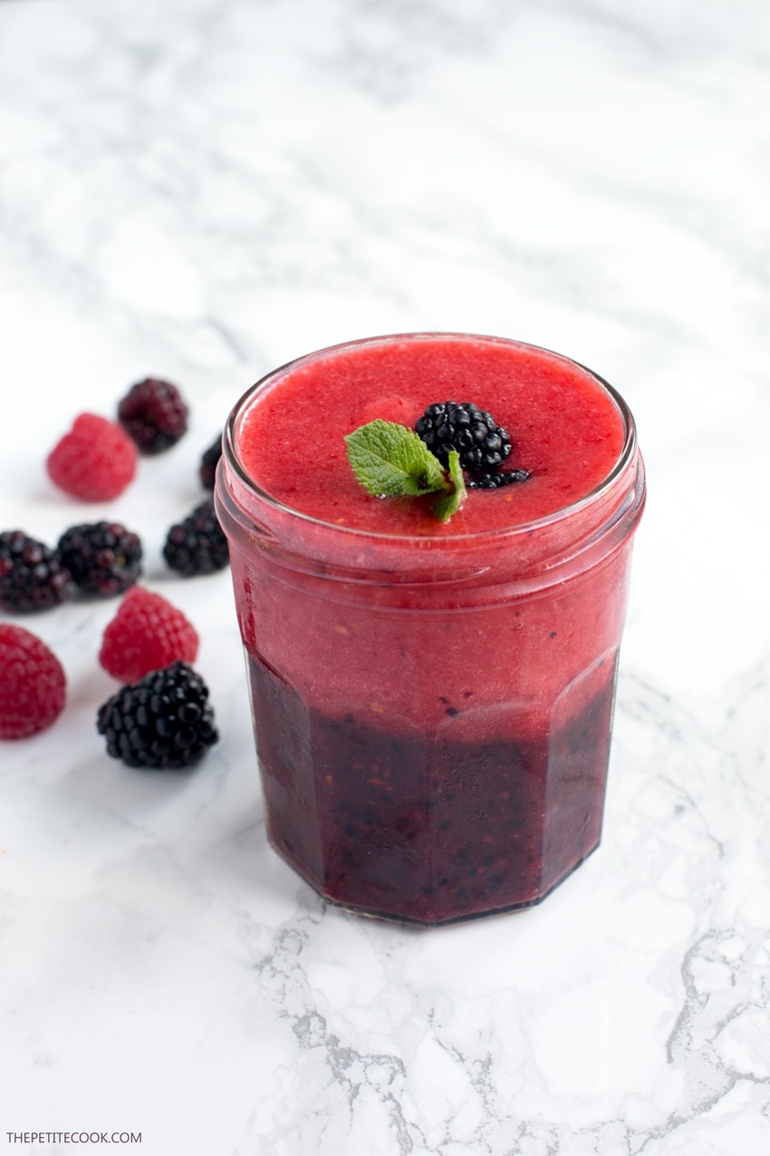 A double-layer of nutritious berry goodness that instantly cheers you up - This Frozen Double Berry Smoothie is the perfect drink to complement spring and summer breakfasts. Vegan and Gluten-free recipe from www.thepetitecook.com