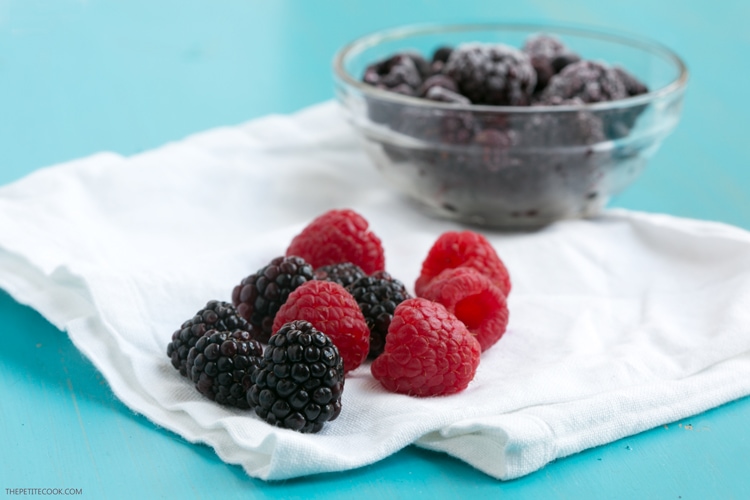 A double-layer of nutritious berry goodness - This Frozen Double Berry Smoothie is the perfect drink to complement spring and summer breakfasts. Vegan and dairy-free recipe from www.thepetitecook.com