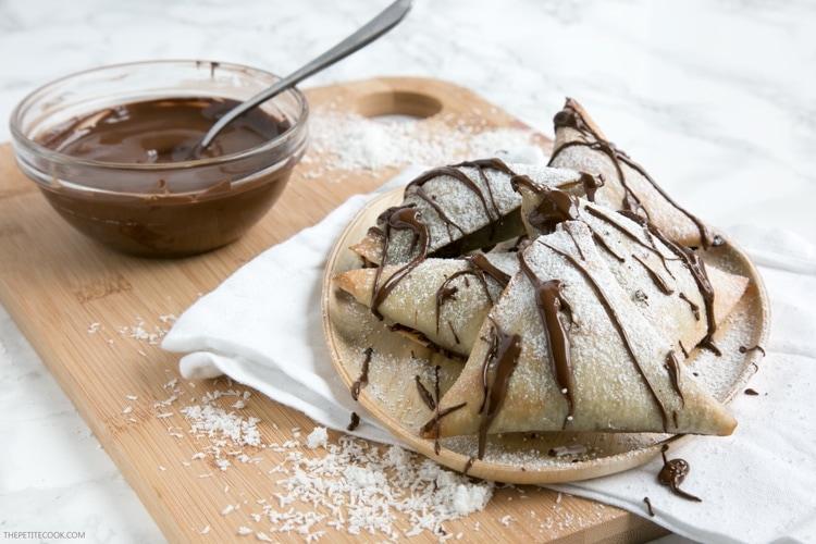 A exciting twist on the traditional Indian snack these Homemade Nutella and Coconut Samosas make an impressive but easy dessert to wow your guests! Recipe from www.thepetitecook.com