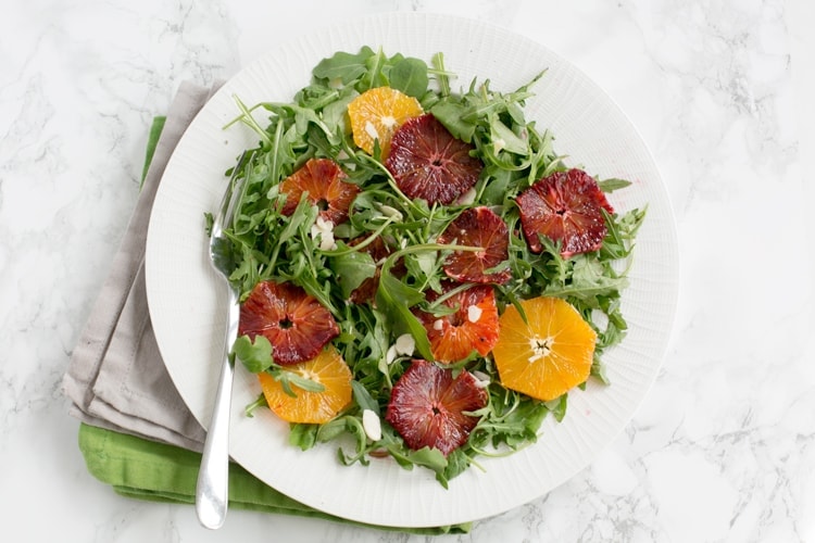 Brighten up your day with this gorgeous Blood Orange and Rocket Salad - Simple, vegan, gluten-free, packed with vibrant colors and so refreshing! Recipe by www.thepetitecook.com