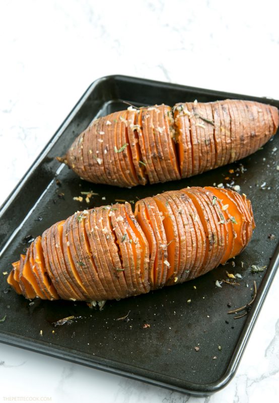 The easiest way to upgrade your typical baked potatoes. Crispy outside and fluffly melt-in-your mouth within, these Hasselback Sweet Potatoes with Guacamole make a great vegetarian spring or/and summer side! Recipe from www.thepetitecook.com