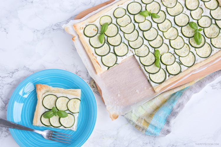 This rustic Zucchini Tart with Ricotta and Fresh Herbs makes a tasty vegetarian meal for any occasion - Ready in 30 mins and requiring just 5 ingredients, it's the perfect addition to any summer table! Recipe from www.thepetitecook.com