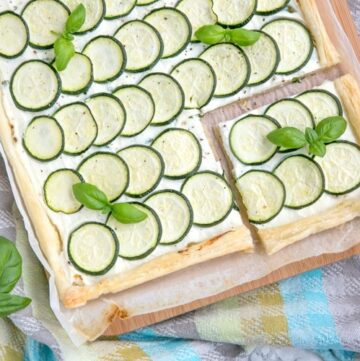 This rustic Zucchini Tart with Ricotta and Fresh Herbs makes a tasty vegetarian meal for any occasion - Ready in 30 mins and requiring just 5 ingredients, it's the perfect addition to any summer table! Recipe from www.thepetitecook.com