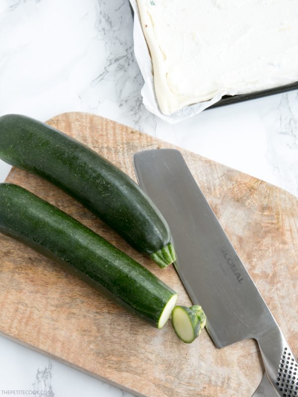 This rustic Zucchini Tart with Ricotta and Fresh Herbs makes a tasty vegetarian meal for any occasion - Ready in 30 mins and requiring just 5 ingredients, it's the perfect addition to any summer table! Recipe from www.thepetitecook.com