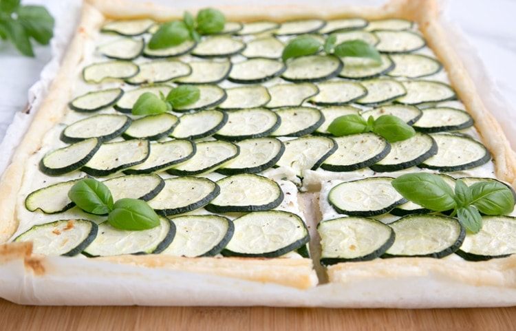 This rustic Zucchini Tart with Ricotta and Fresh Herbs makes a tasty vegetarian meal for any occasion - Ready in 30 mins and requiring just 5 ingredients, it's the perfect addition to any summer table! Recipe from www.thepetitecook.com