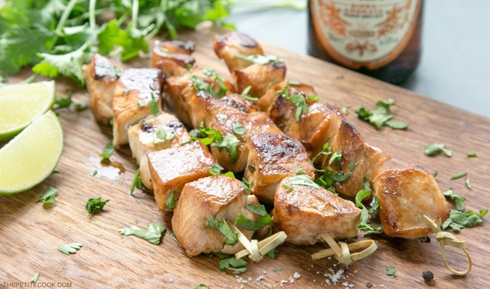 Juicy, tender, tangy, crispy, deliciously savory. These Beer Lime Chicken Skewers are a light but tasty addition to any BBQ party. And quick enough to be made during the work week for an easy fuss-free dinner option. Recipe from www.thepetitecook.com