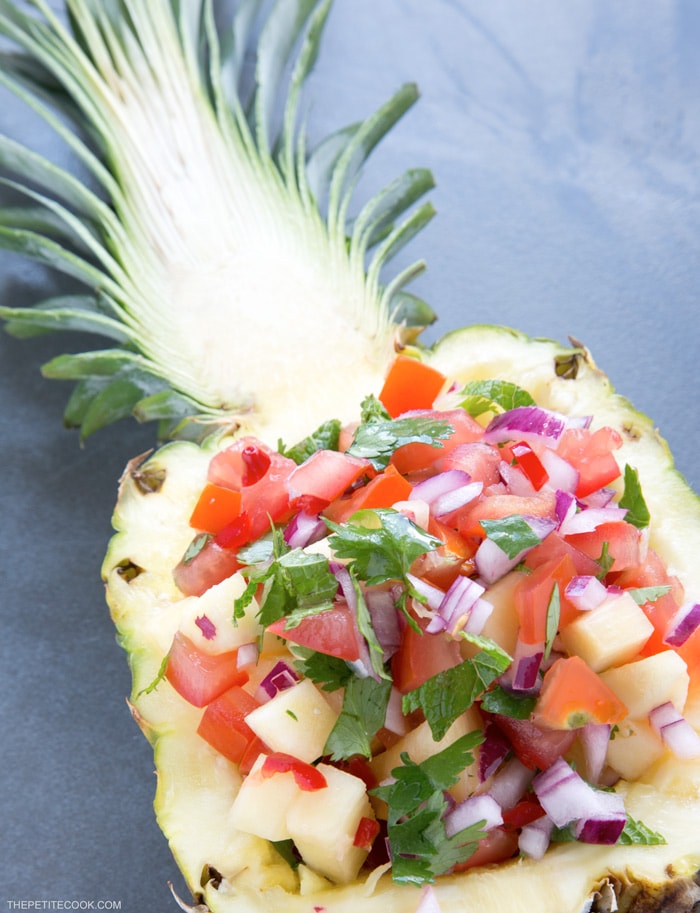A delicious combo of sweet & spicy flavors makes this Easy Pineapple Salsa just the perfect side for any grilled meat or fish! Recipe from www.thepetitecook.com