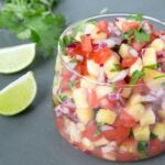 A delicious combo of sweet & spicy flavors makes this Easy Pineapple Salsa just the perfect side for any grilled meat or fish! Recipe from www.thepetitecook.com