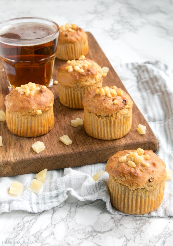 These Cheesy Parmesan Beer Muffins are a great grab-and-go snack or make-ahead lunchbox option - Super fluffy, packed with flavors, vegetarian and no butter or eggs required! Recipe from www.thepetitecook.com