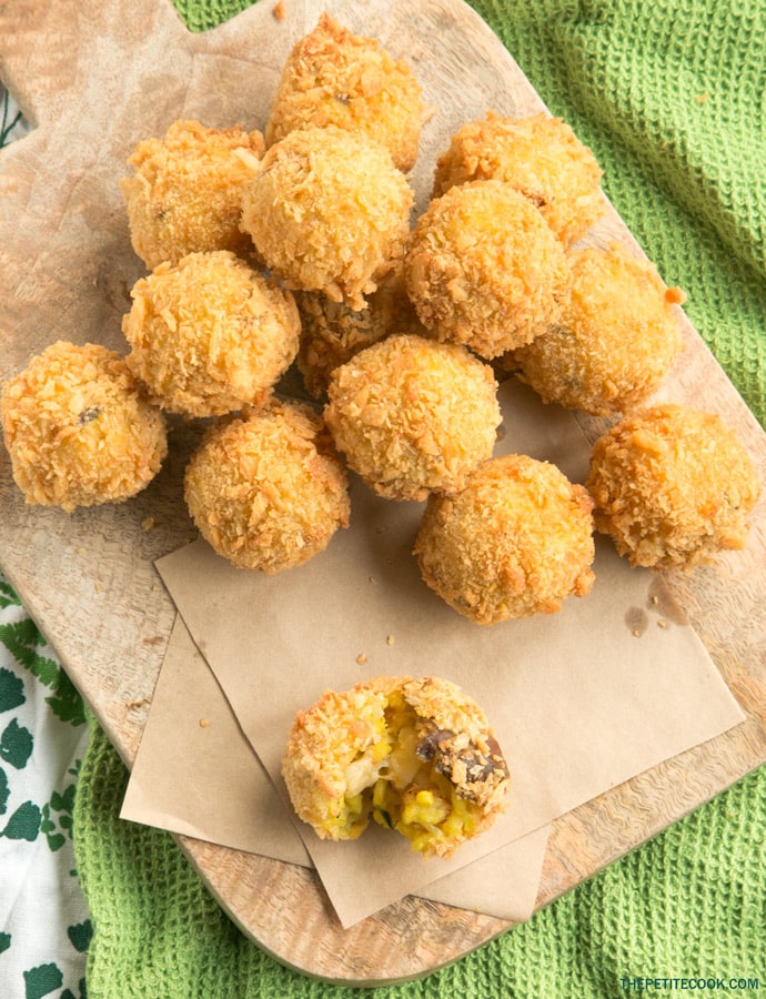 mushroom arancini on a wood board