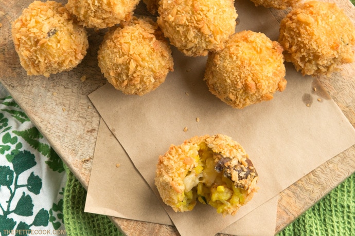 sicilian small arancini on a woodboard