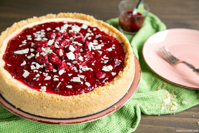 Sweet and tangy flavors combine beautifully to make one of the most iconic desserts ever - This New York style Raspberry Cheesecake is pure heaven in a bite! Recipe from www.thepetitecook.com