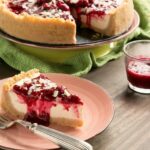 Sweet and tangy flavors combine beautifully to make one of the most iconic desserts ever - This New York style Raspberry Cheesecake is pure heaven in a bite! Recipe from www.thepetitecook.com