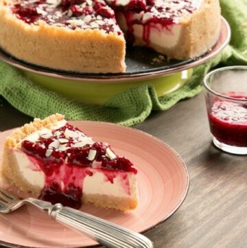 Sweet and tangy flavors combine beautifully to make one of the most iconic desserts ever - This New York style Raspberry Cheesecake is pure heaven in a bite! Recipe from www.thepetitecook.com
