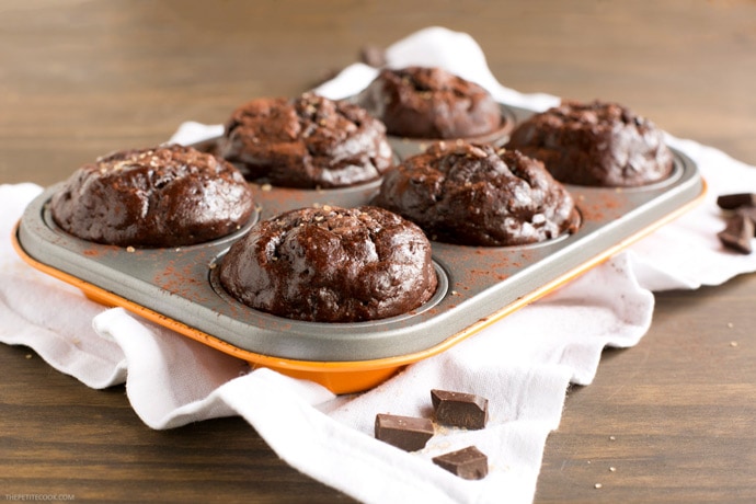 Soft, rich and extra chocolaty - These low fat Double Chocolate Banana Bread Muffins don't require extra refined sugar, oil or butter but are crazy moist and loaded with banana and chocolate flavor. Recipe from www.thepetitecook.com