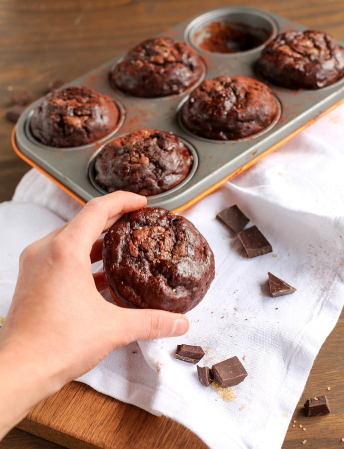 Soft, rich and extra chocolaty - These low fat Double Chocolate Banana Bread Muffins don't require extra refined sugar, oil or butter but are crazy moist and loaded with banana and chocolate flavor. Recipe from www.thepetitecook.com