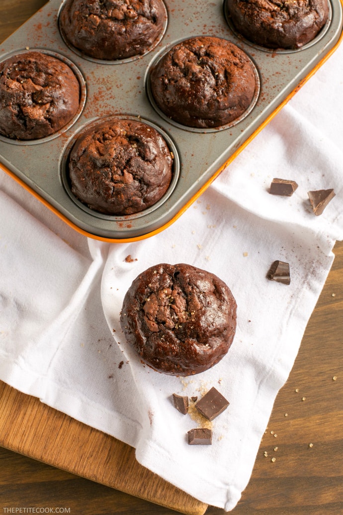 Soft, rich and extra chocolaty - These low fat Double Chocolate Banana Bread Muffins don't require extra refined sugar, oil or butter but are crazy moist and loaded with banana and chocolate flavor. Recipe from www.thepetitecook.com