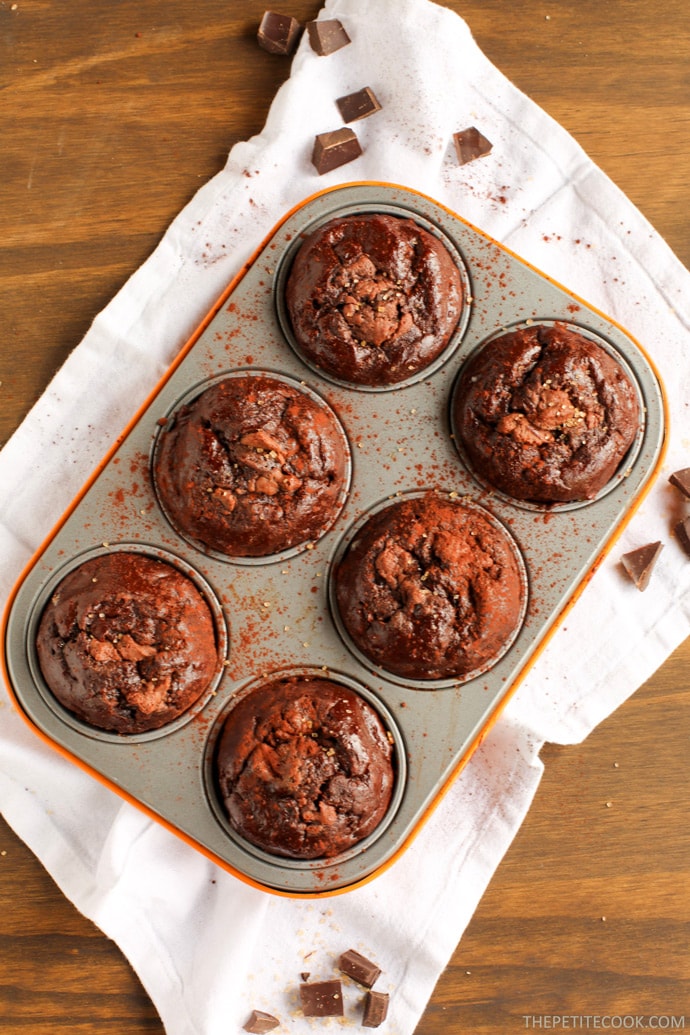 Soft, rich and extra chocolaty - These low fat Double Chocolate Banana Bread Muffins don't require extra refined sugar, oil or butter but are crazy moist and loaded with banana and chocolate flavor. Recipe from www.thepetitecook.com